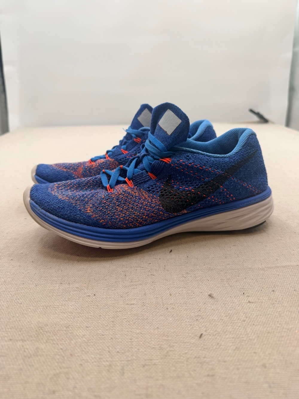 Nike Flyknit Running Shoes in Blue with Orange Accents